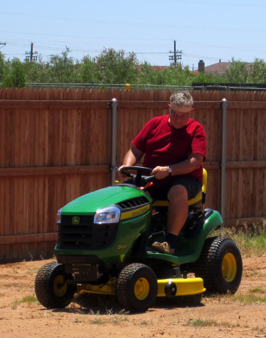 Dave, the gentleman farmer, on his new John Deere.