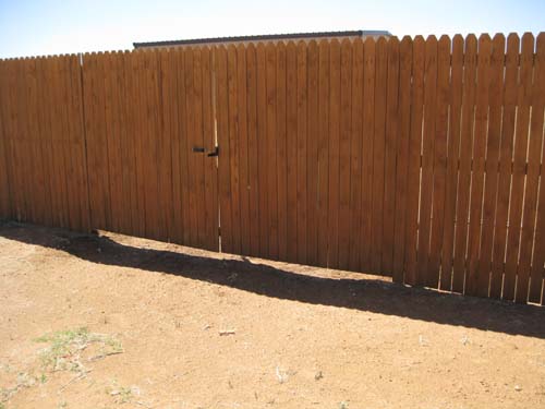 Fix gaps under fences to keep dog in and other creatures out.